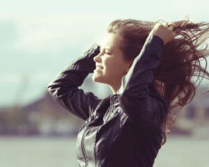 woman with wind blowing face